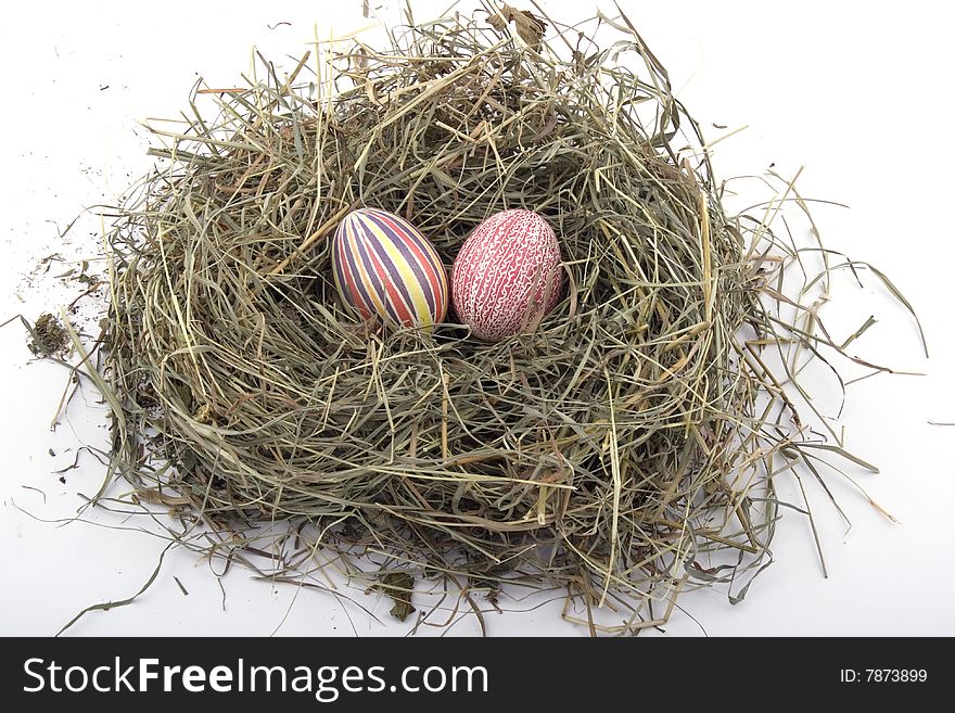 Handmade colored Easter eggs in the nest