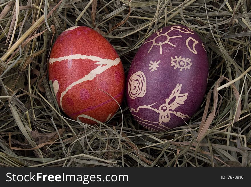 Handmade colored Easter eggs in the nest