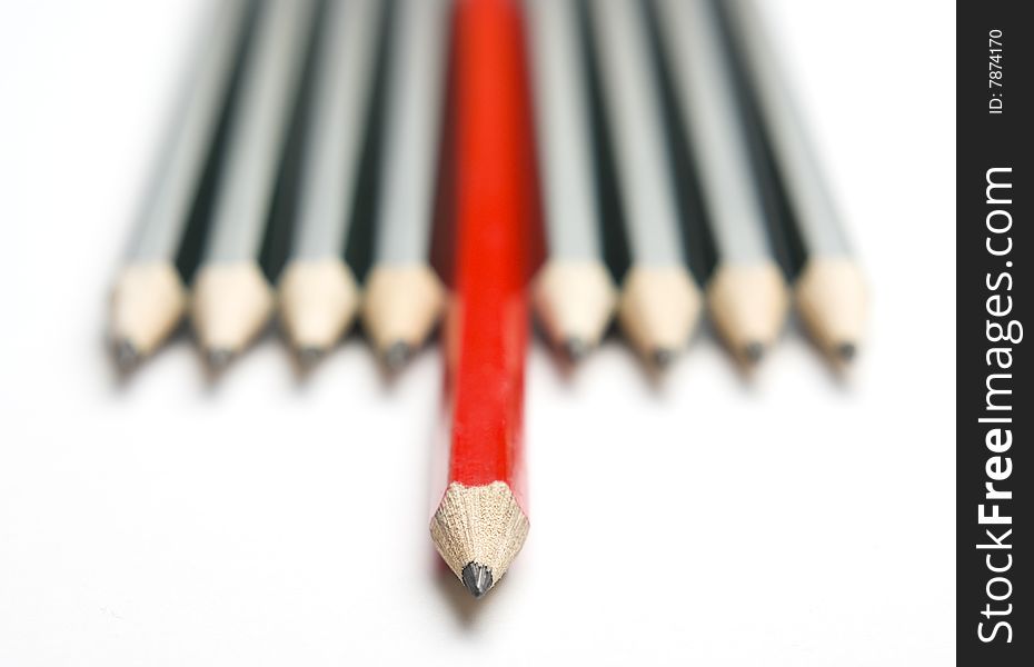Group of pencils with one highlighted as business concept for leadership, winning and standing out from the crowd. Group of pencils with one highlighted as business concept for leadership, winning and standing out from the crowd.