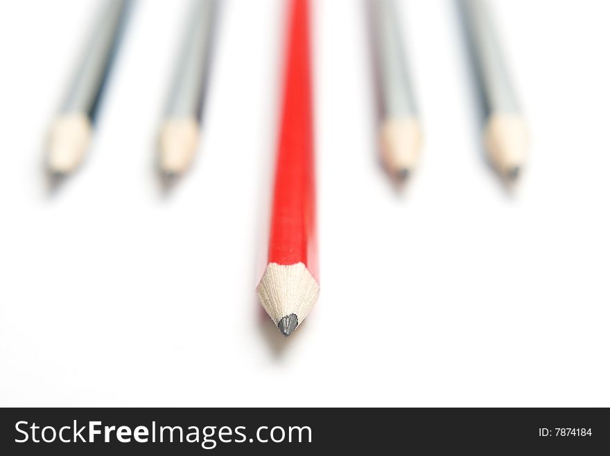 Group of pencils with one highlighted as business concept for leadership, winning and standing out from the crowd. Group of pencils with one highlighted as business concept for leadership, winning and standing out from the crowd.
