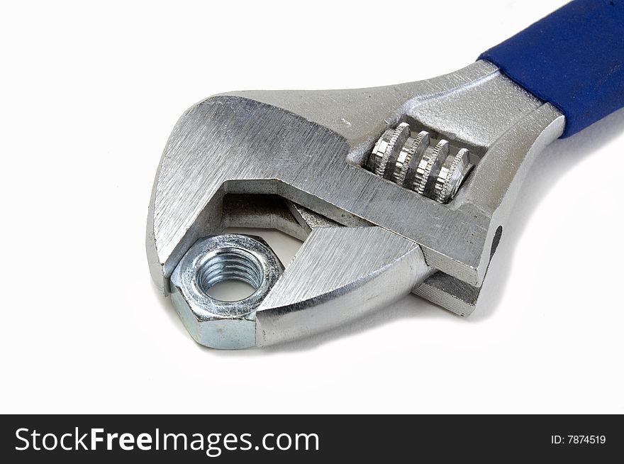 Close-up shot of an adjustable wrench on a white background