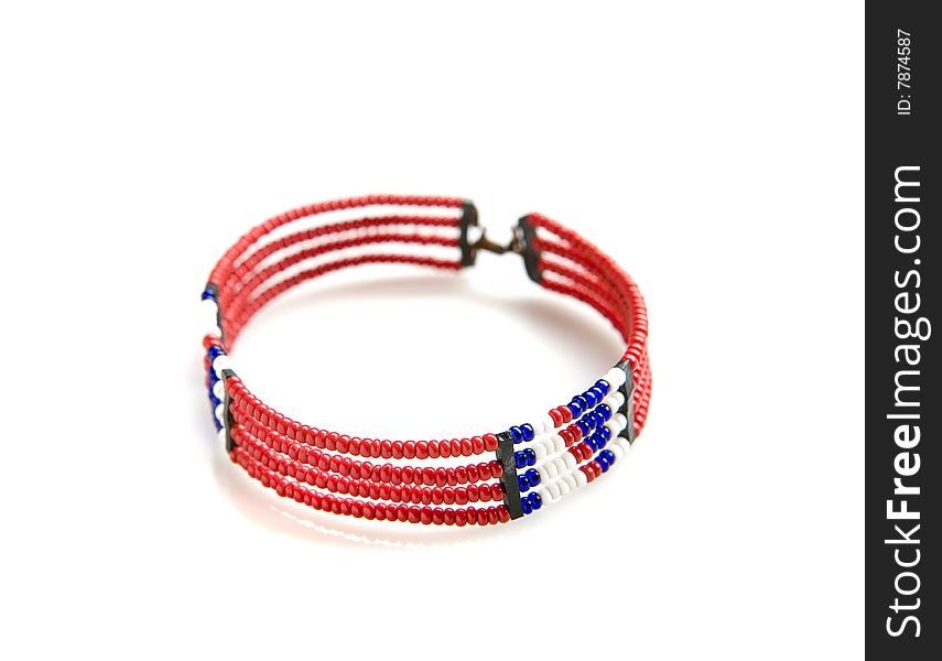 Red african bracelet on white ground