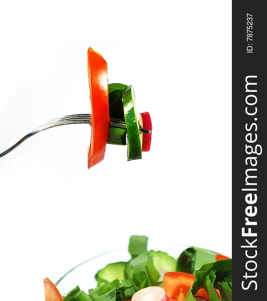 Spring vegetable salad isolated on white background