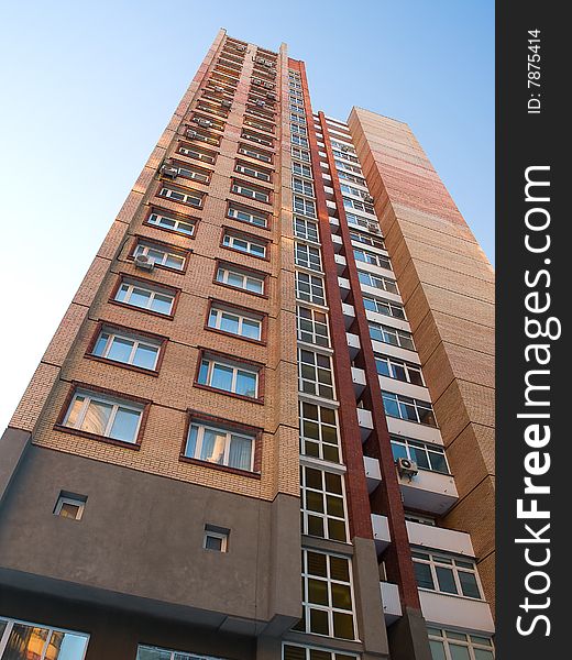 High residential building on a blue background