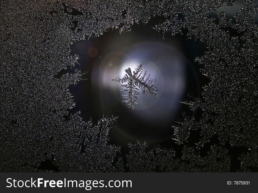 Close-up view of tiny ice crystals on a window.