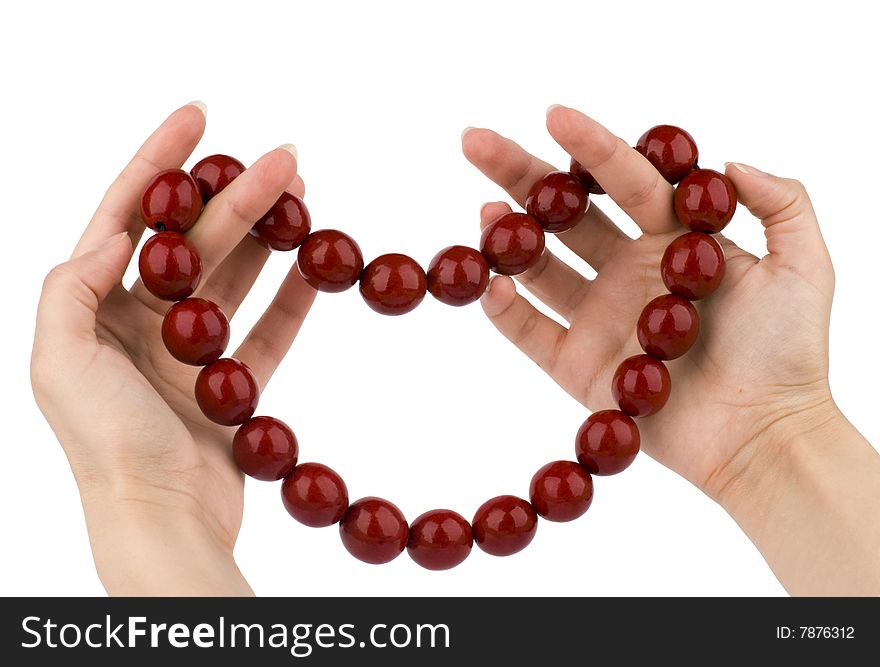 Red beads in hands. Gift to Valentines Day