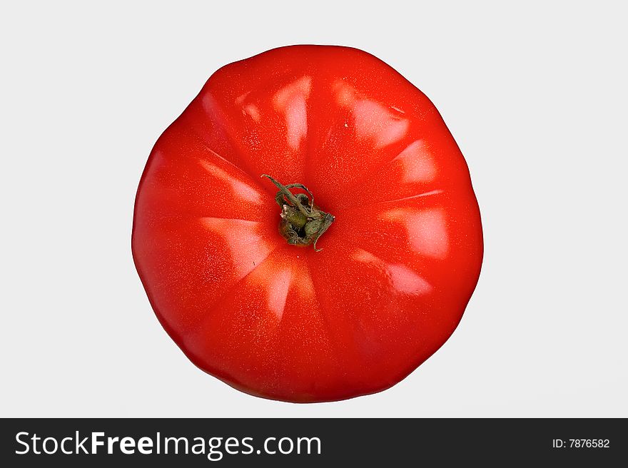Vegetable tomato on a grey background