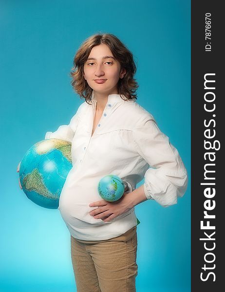 The pregnant woman On a blue background. The pregnant woman On a blue background