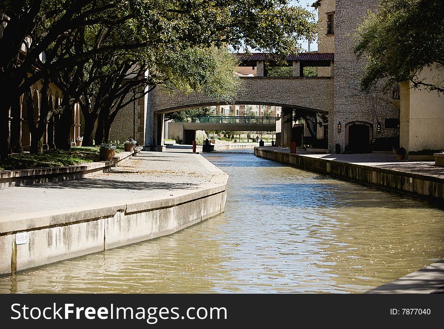 An image of a river running through a business park area