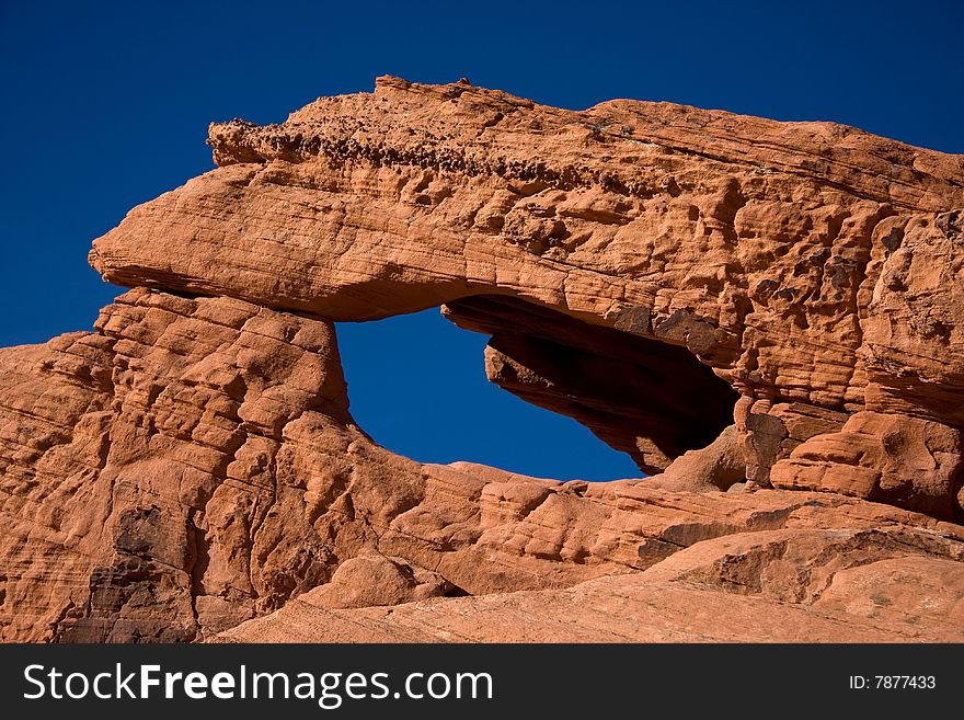 The Valley of Fire derives its name from red sandstone formations, formed from great shifting sand dunes during the age of dinosaurs. Complex uplifting and faulting of the region, followed by extensive erosion, have created the present landscape. The Valley of Fire derives its name from red sandstone formations, formed from great shifting sand dunes during the age of dinosaurs. Complex uplifting and faulting of the region, followed by extensive erosion, have created the present landscape.