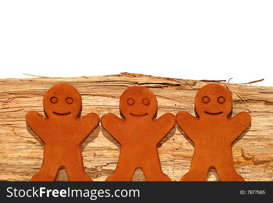 Gingerbread Men Against Firewood Background