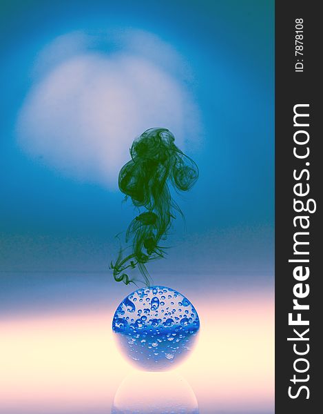 Blue globe with smoke. Conceptual scene about war and disasters over the world.