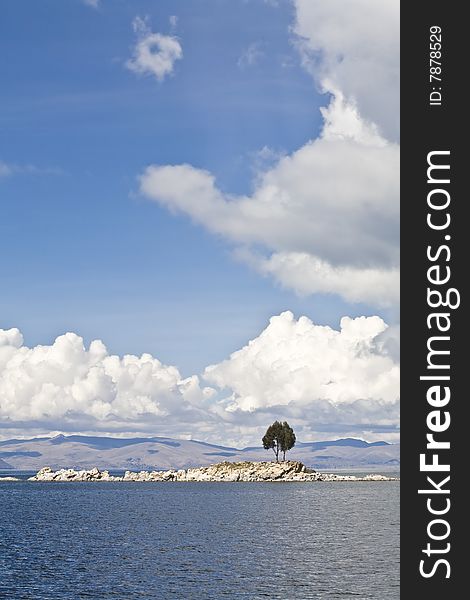 A single tree on and rocky island on Lake Titicaca. A single tree on and rocky island on Lake Titicaca.