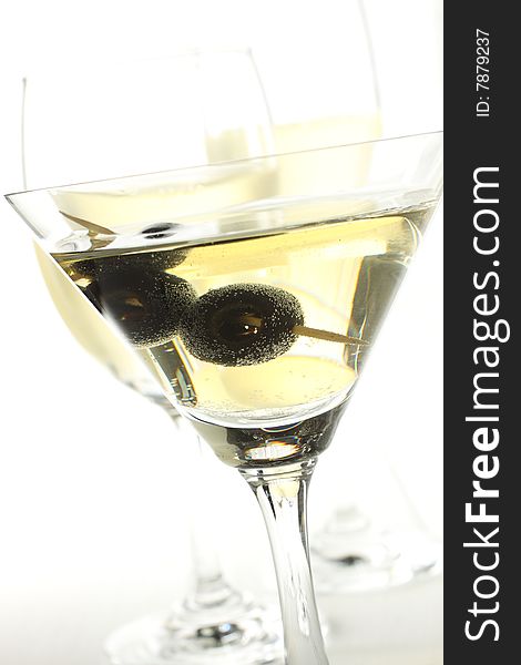 White wine and black olive in a glass for a party!. White wine and black olive in a glass for a party!