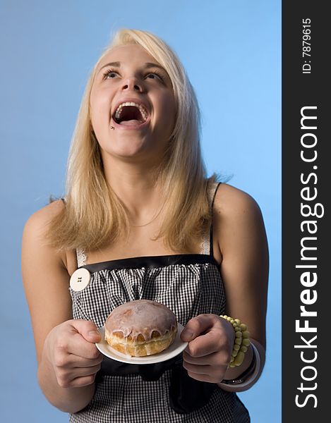 Teenager with the doughnut on the plate. Teenager with the doughnut on the plate