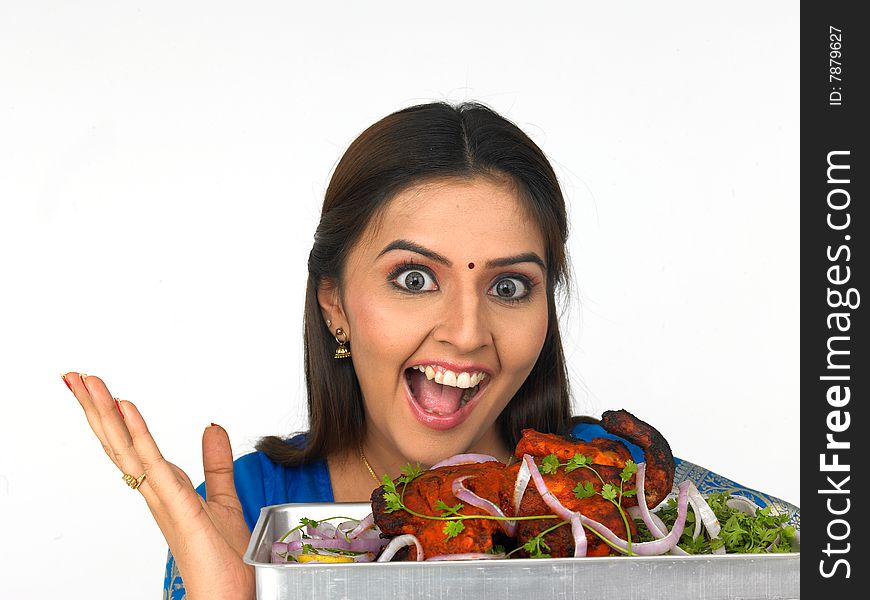 A happy young woman with her roasted chicken and mouth watering