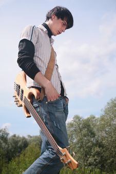 Young Man With Guitar Stock Image
