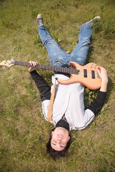 Young Man Lies With Guitar Stock Photography Young Man Lies With Guitar Stock Photography