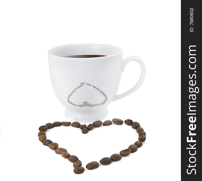 Coffee cup with heart from coffee beans