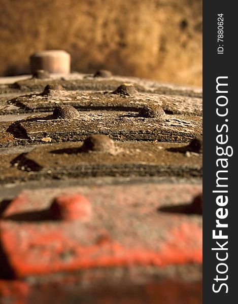 Detail of a very old, rusty barrel in the wine cellar. Detail of a very old, rusty barrel in the wine cellar