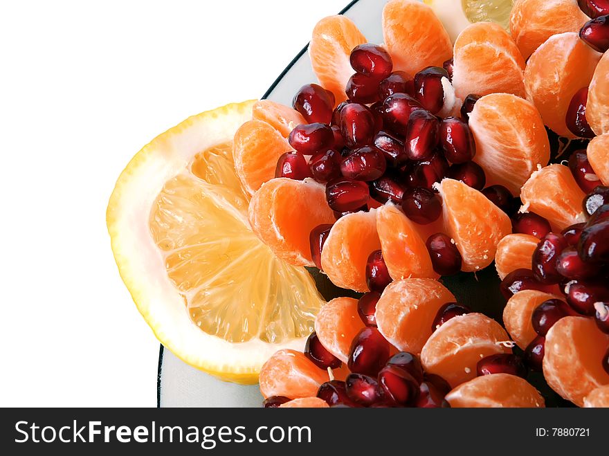 Beautiful still life of tangerine stuffed with pomegranate seeds