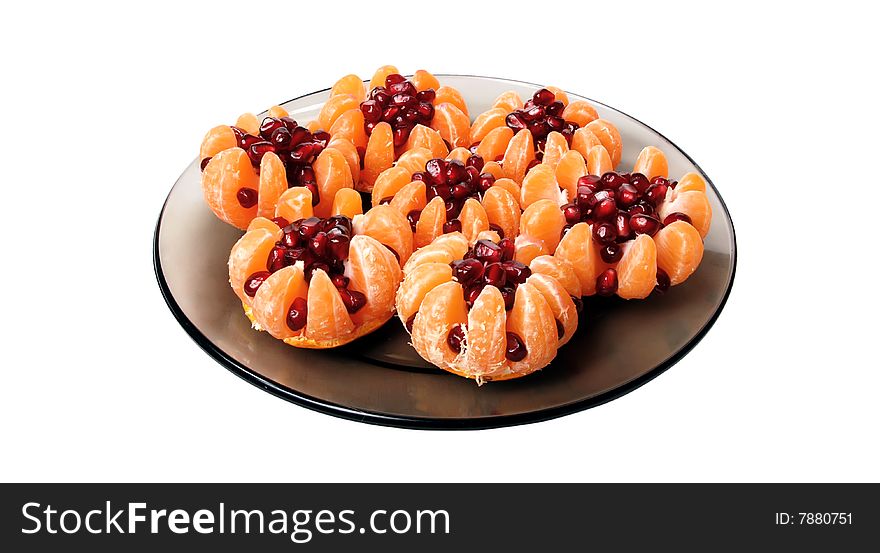 Beautiful still life of tangerine stuffed with pomegranate seeds