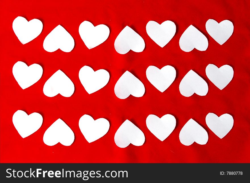 Beautiful texture of white hearts on a red background. Beautiful texture of white hearts on a red background