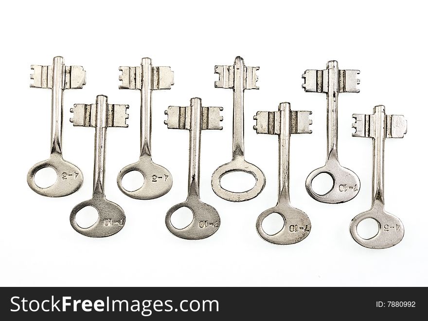 Set of old keys isolated on white background