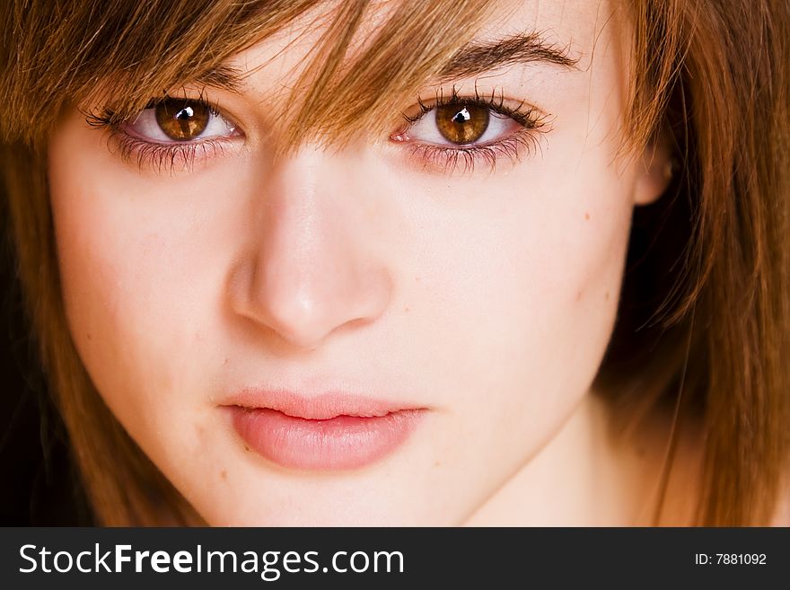 Young staring woman close portrait