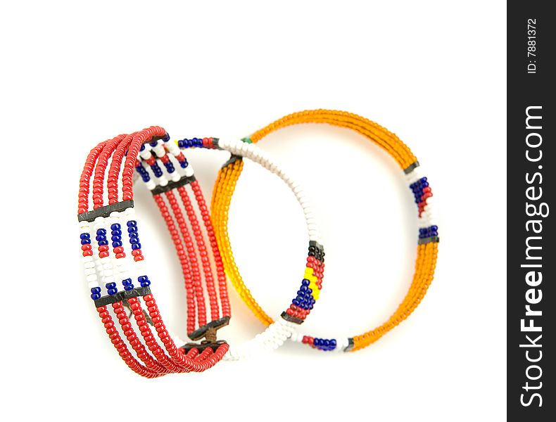 Three african bracelets on white ground