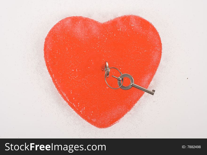 Red heart with key isolated on white background