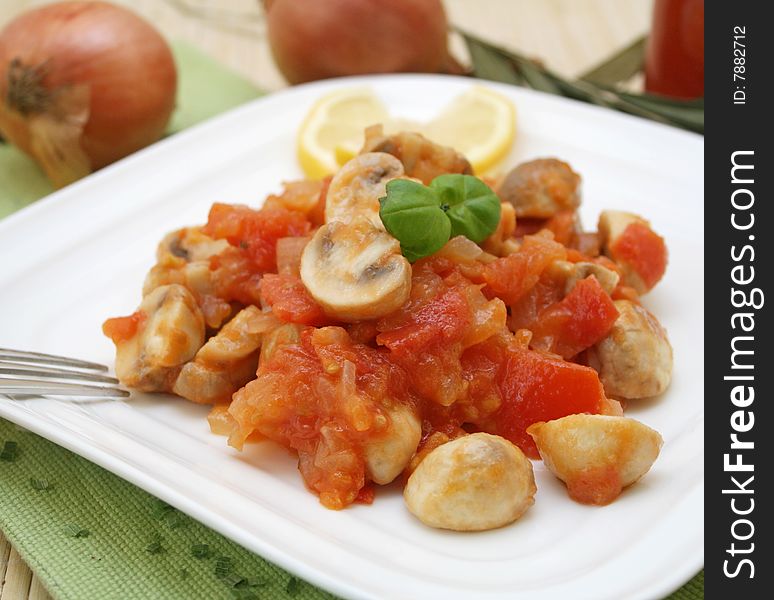 A fresh meal of mushrooms with tomatoes and spices. A fresh meal of mushrooms with tomatoes and spices