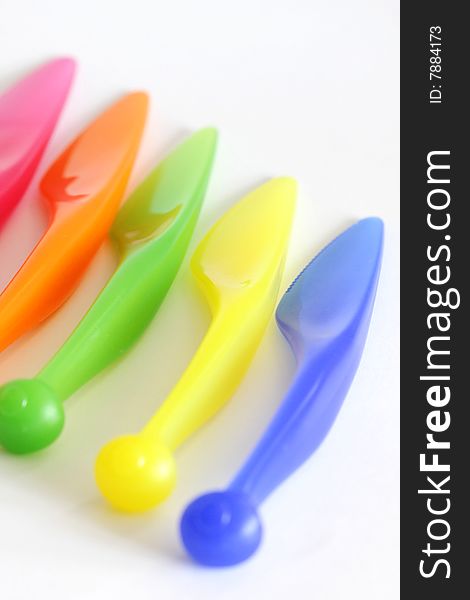 Color plastic knives close up