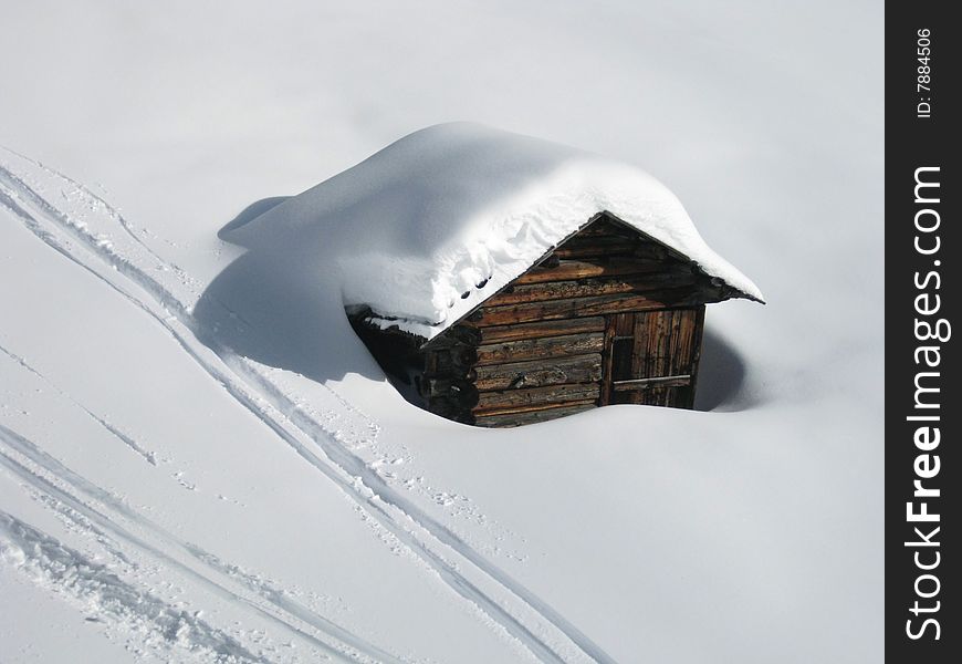 Litlle wooden snow-covered cottage, Alta Badia, Dolomiti,Italy. Litlle wooden snow-covered cottage, Alta Badia, Dolomiti,Italy