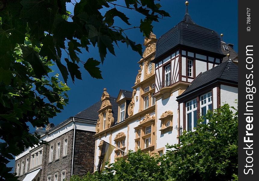 Two traditional highly decorated timber frame houses in Bernkastel-Kues in the Mosel (wine region) Valley of Germany. Two traditional highly decorated timber frame houses in Bernkastel-Kues in the Mosel (wine region) Valley of Germany