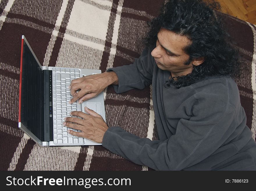 Man working at home with laptop