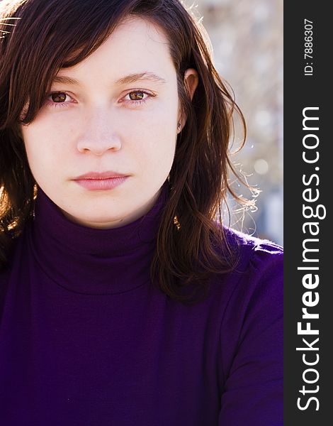 Young caucasian woman portrait staring at camera.