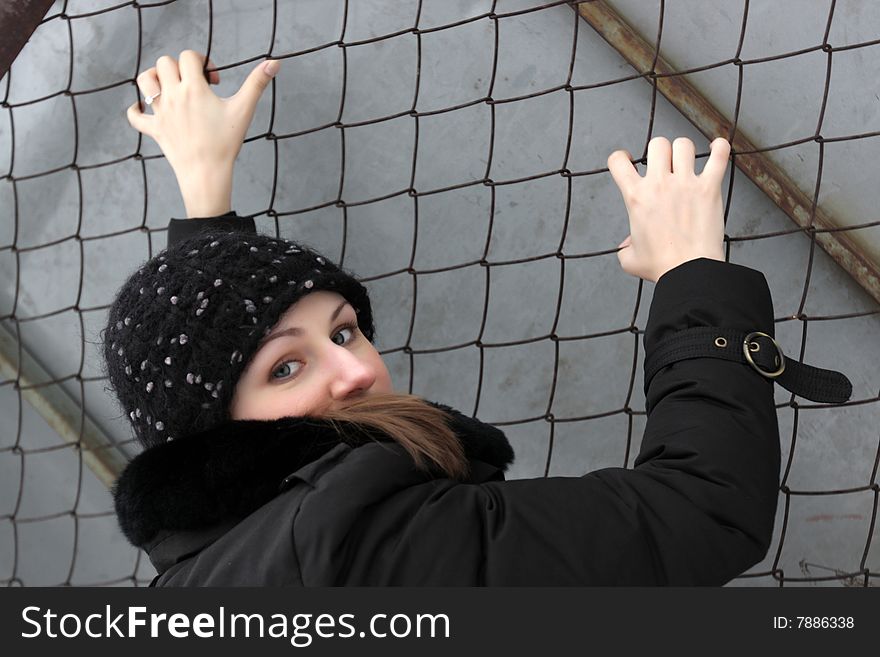 Girl climbs a net