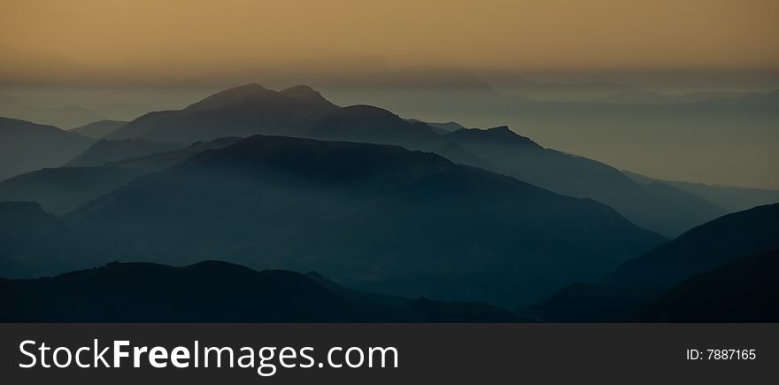 Foggy dawn mountains