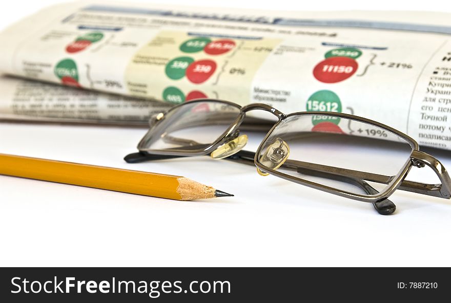 Newspaper and glasses isolated on white background