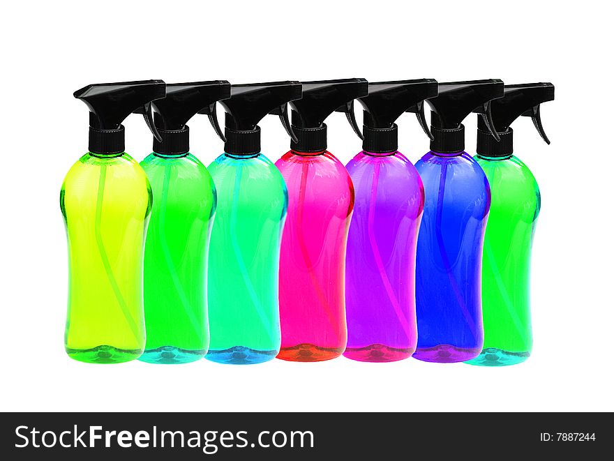 Lots of colourful bottles of cleaning products on white