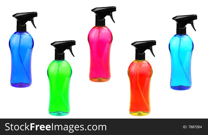 Lots of colourful bottles of cleaning products on white