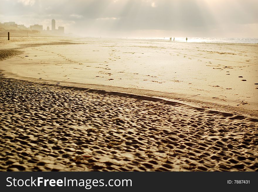 Beach with a texture of sand, narrow of the sunlight as a background. Beach with a texture of sand, narrow of the sunlight as a background.