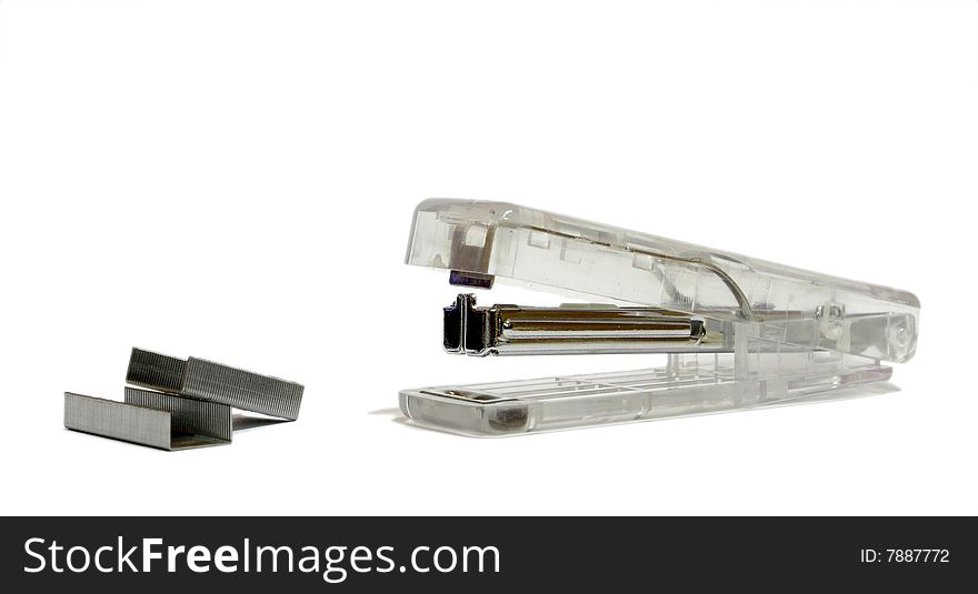 A transparent stapler isolated in white background