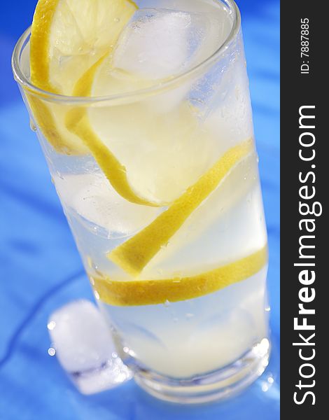 Lemon slices covered in ice water. Lemon slices covered in ice water