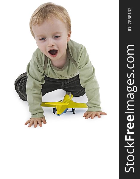 Boy playing with toy on white background. Boy playing with toy on white background