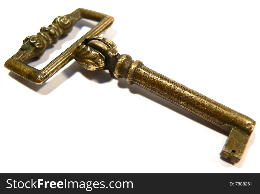Old key with interesting details over white. Old key with interesting details over white