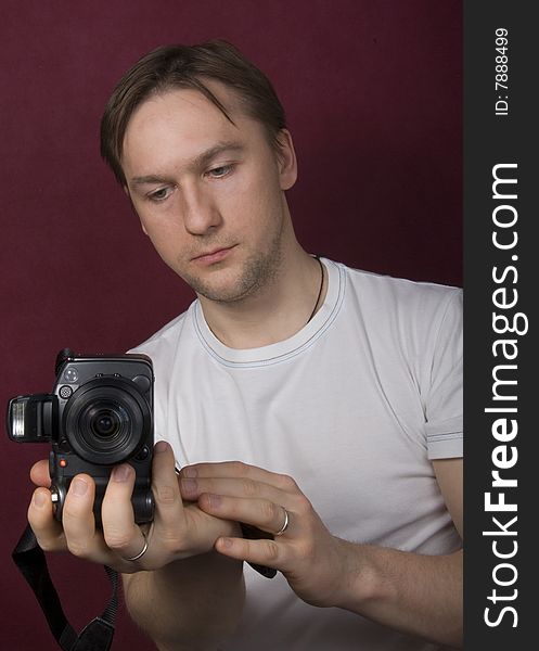 Portrait of a young man on the purple background. Portrait of a young man on the purple background