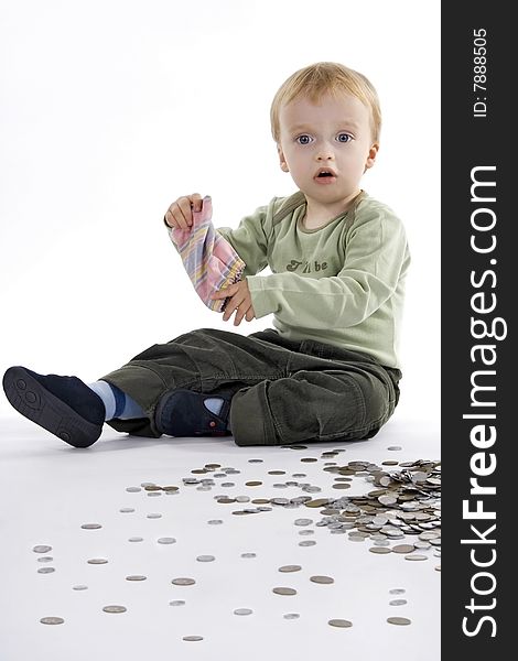 Boy scattered small change on egg white background. Boy scattered small change on egg white background