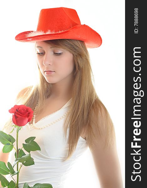 Beautiful young womÐ°n with rose on white background